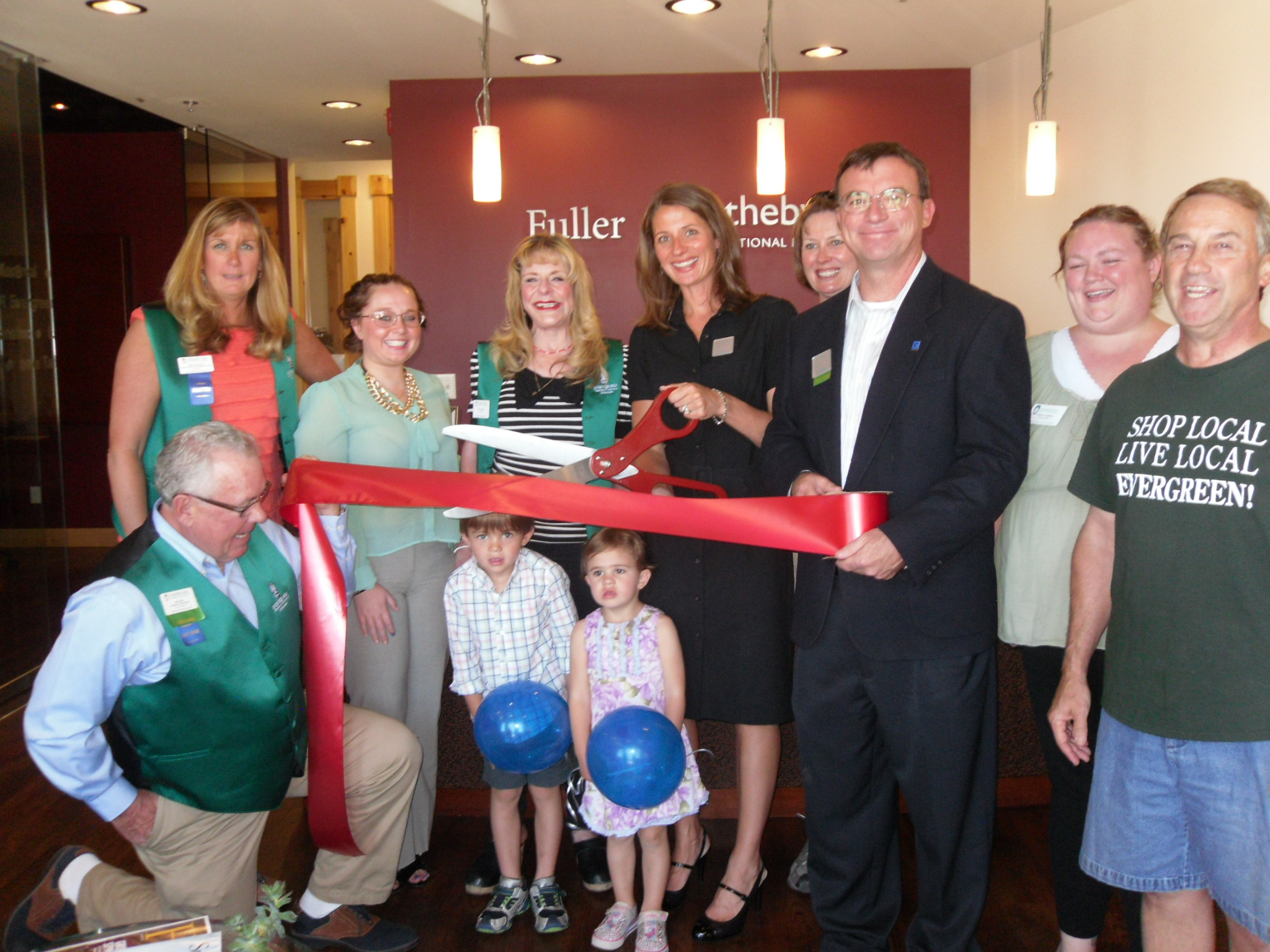 FSIR Evergreen broker, Christy Schoonover, assisting in the EACC ribbon cutting