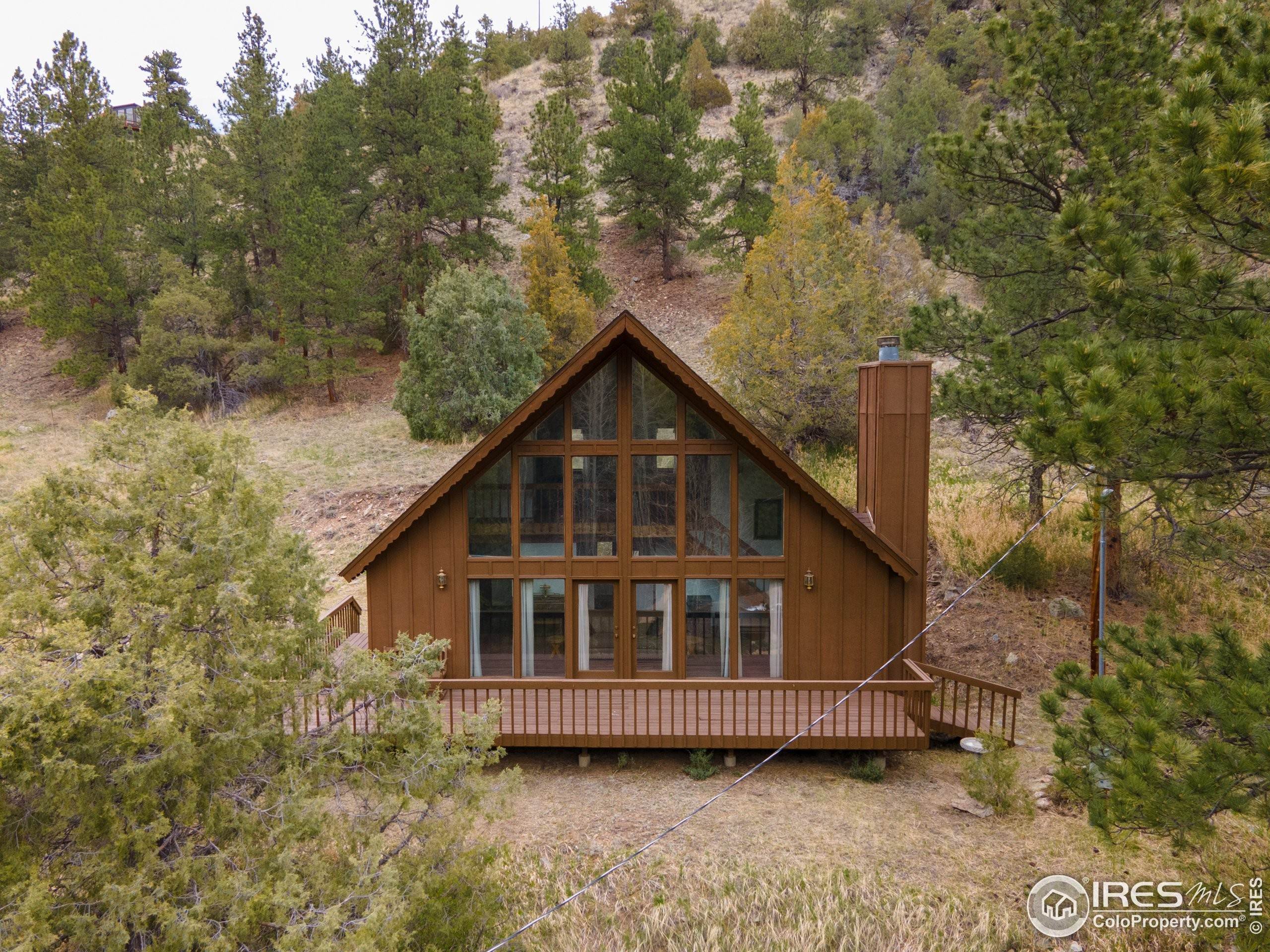 Single Family Homes por un Venta en 1052 Streamside Drive Glen Haven, Colorado 80532 Estados Unidos